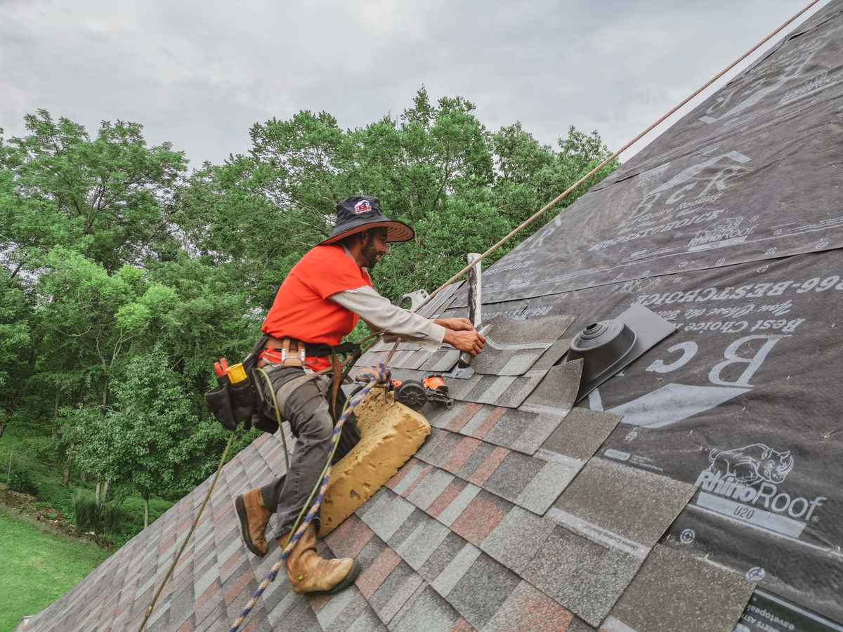 Roofline Exteriors crew installing residential roof